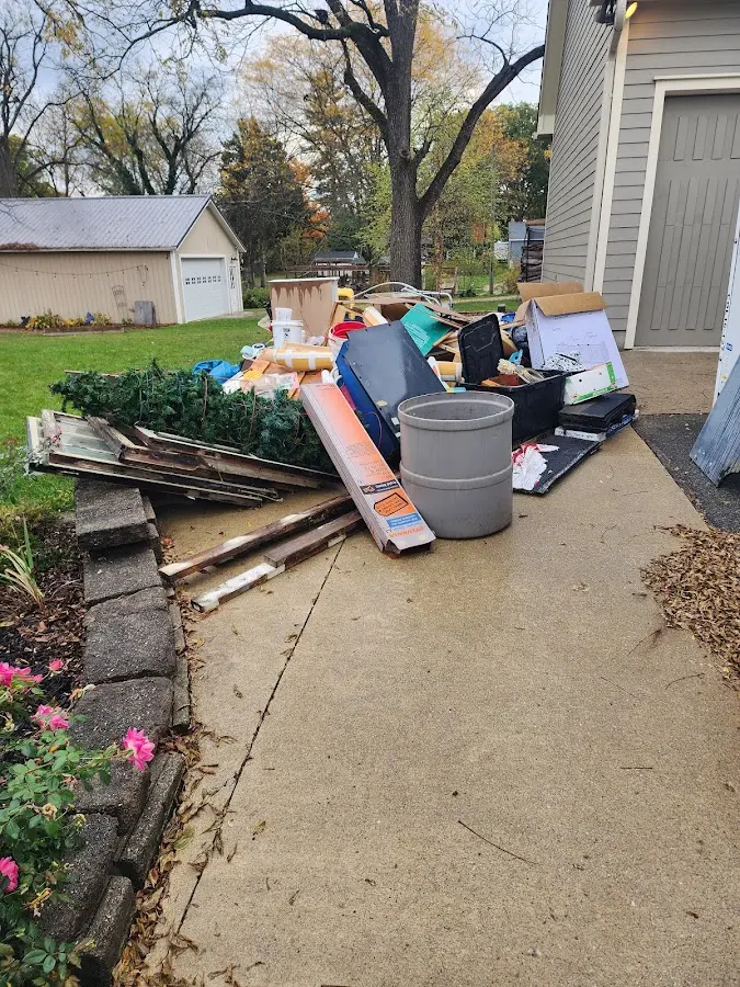 Dumpster being loaded with debris for 10 Yard Dumpster Rental in Wawayanda